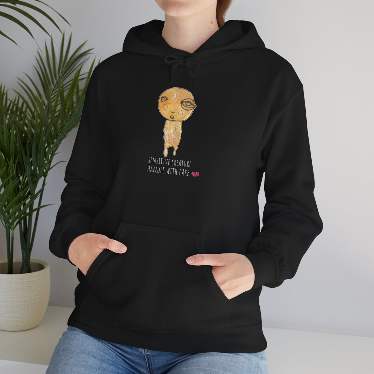 Sensitive Creature. Handle with Care hoodie by C.Cambrea, close-up of print detail