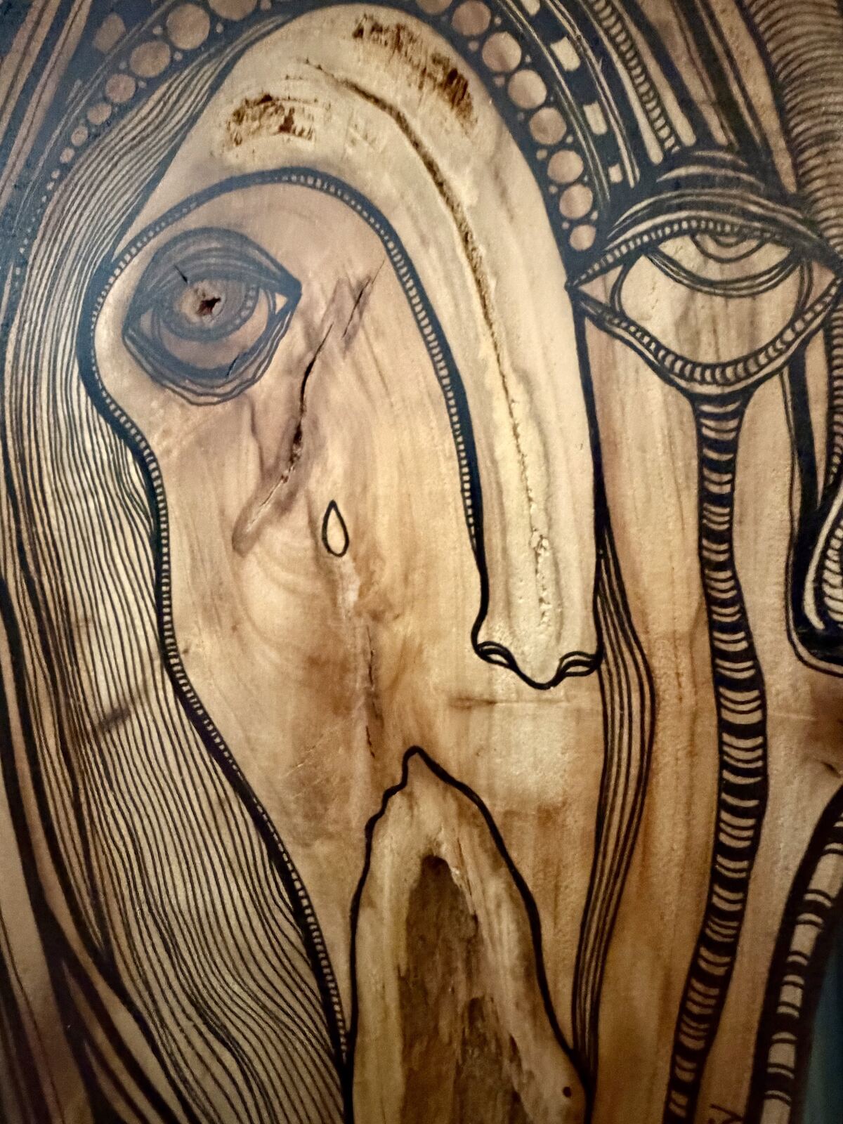 AHHH - close up detail of eye and tear, wood burned pyrography art by C. Cambrea