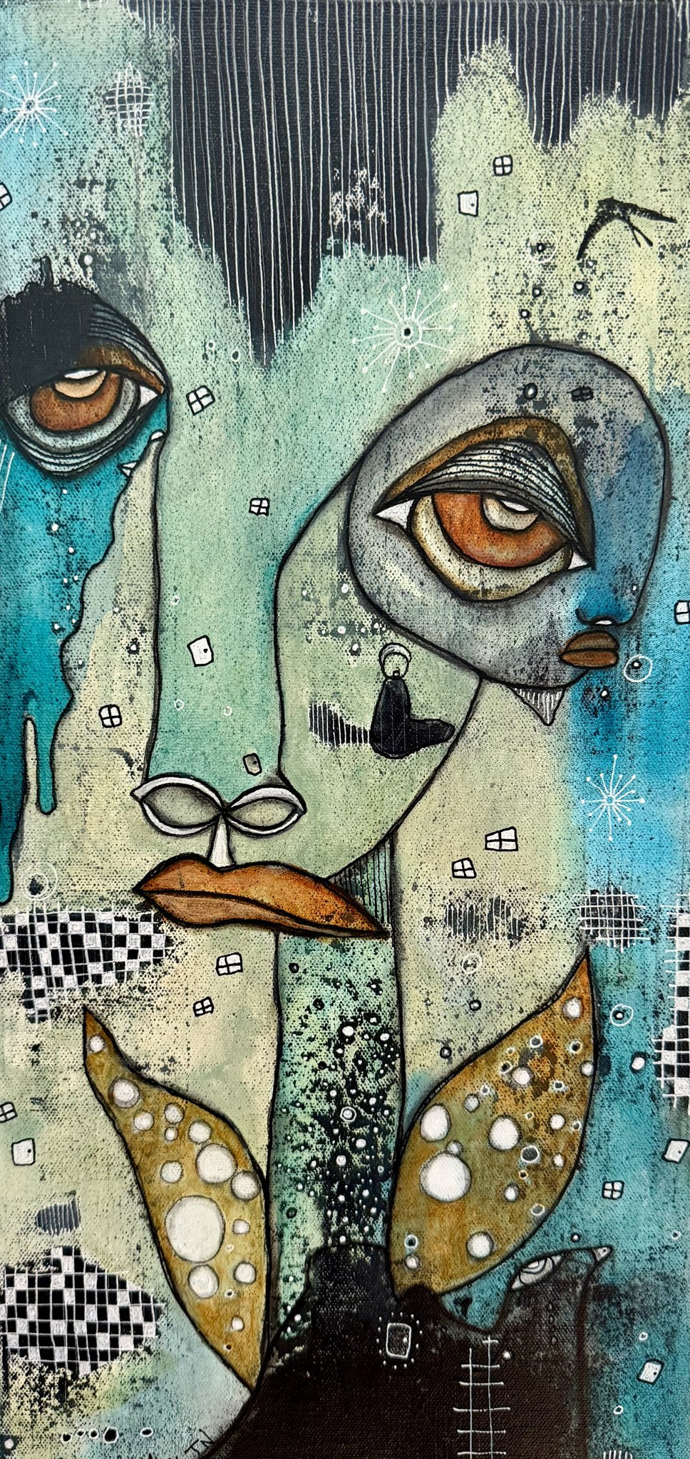 Full canvas view of two overlapping teal and gold faces with blue tear drips, a checkered pattern, and dotted leaf-shaped wing motifs