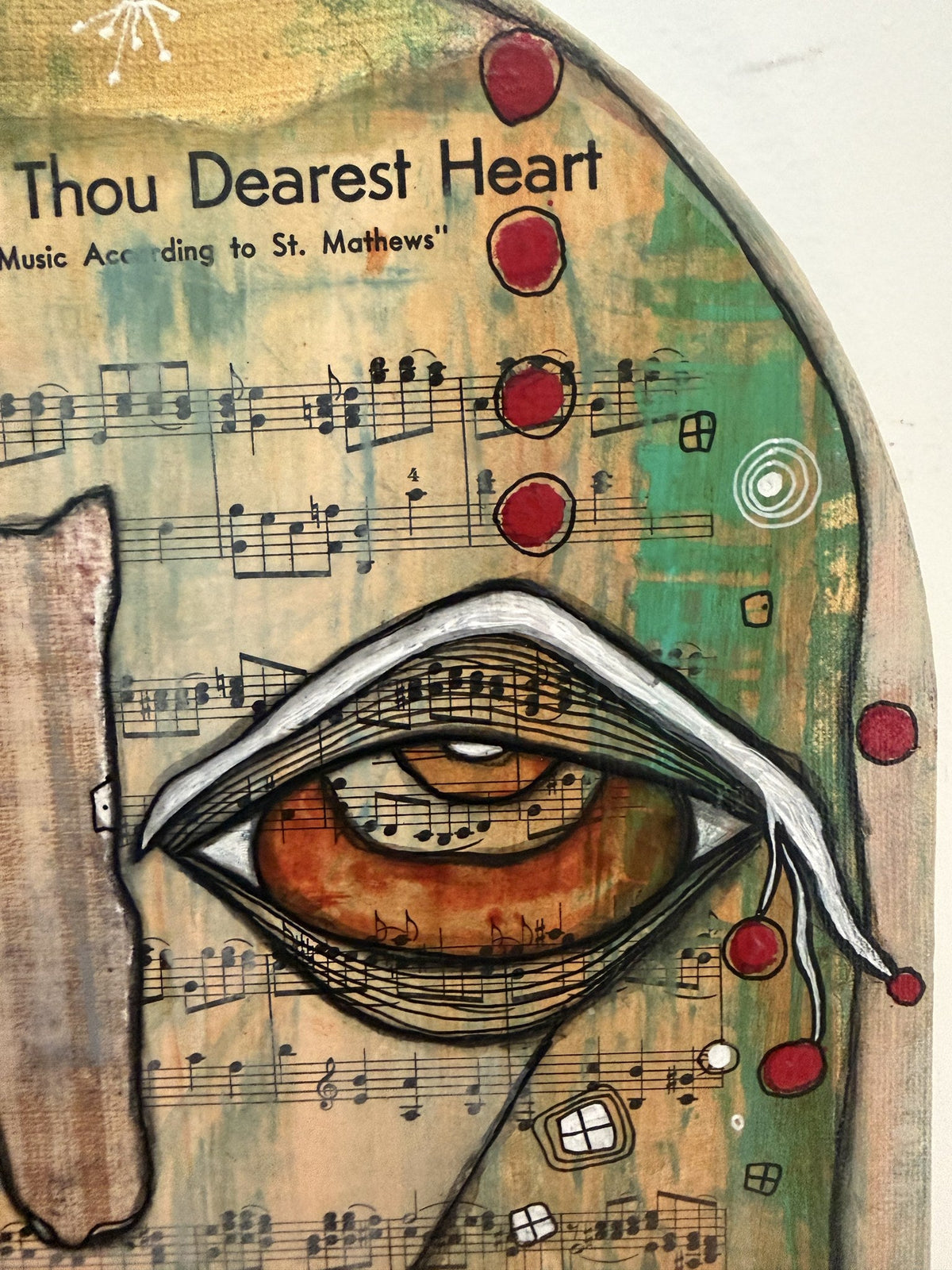 Close-up of an eye beneath the words 'Thou Dearest Heart' with red circles and sheet music notation.