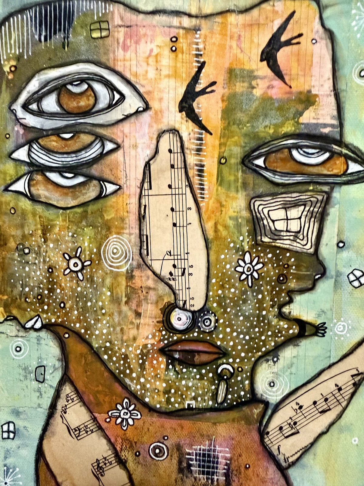 Full view of three stacked eyes, dual eyes on right, sheet-music wings, birds, and reaching hands