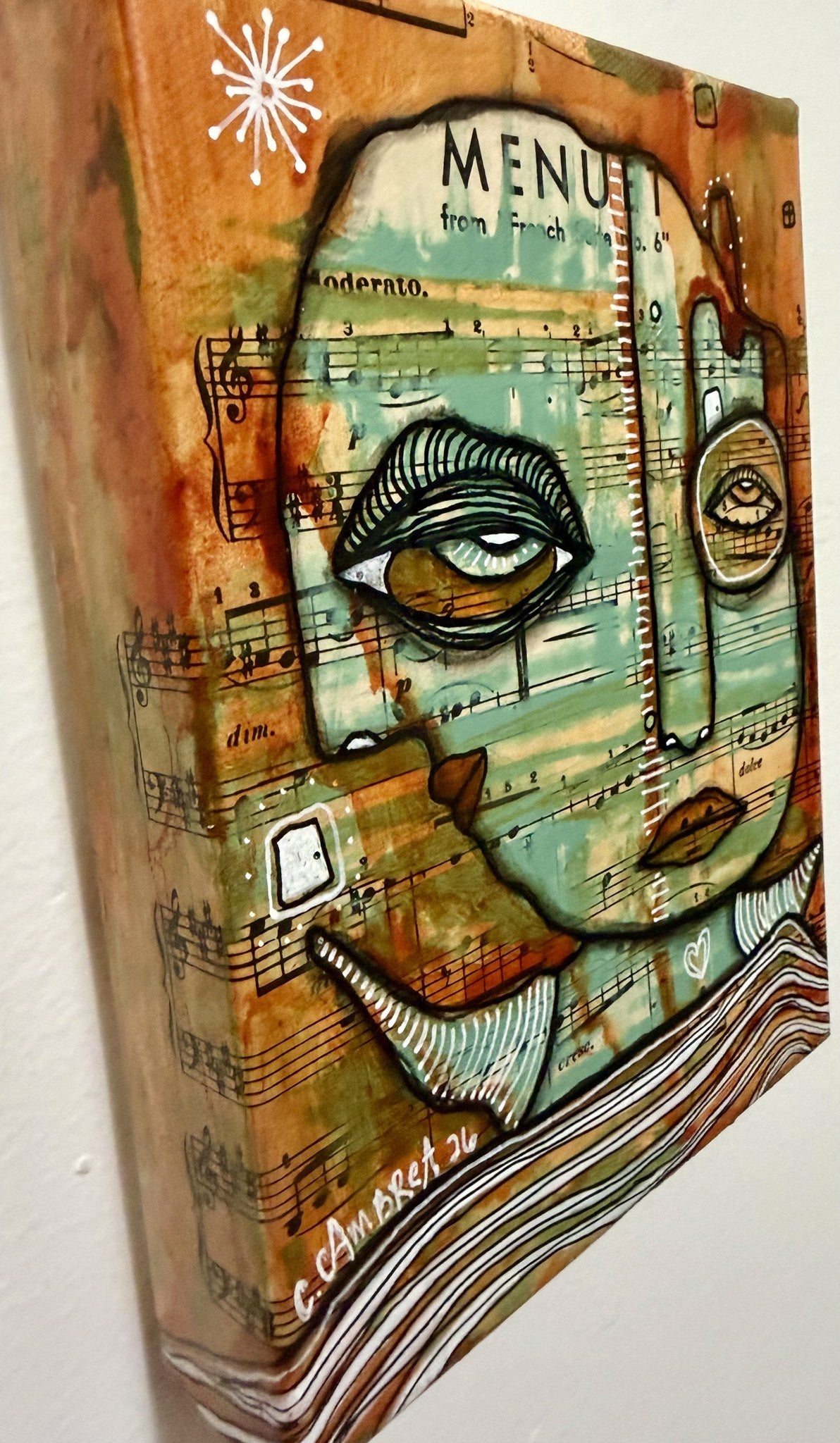 Angled view from the opposite side showing canvas thickness, hidden eyes, and the artist's signature and date