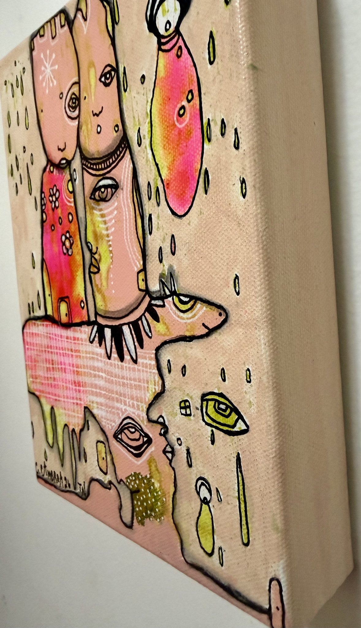 Angled side view of the mixed media canvas revealing its 1.5 inch depth and hidden faces.