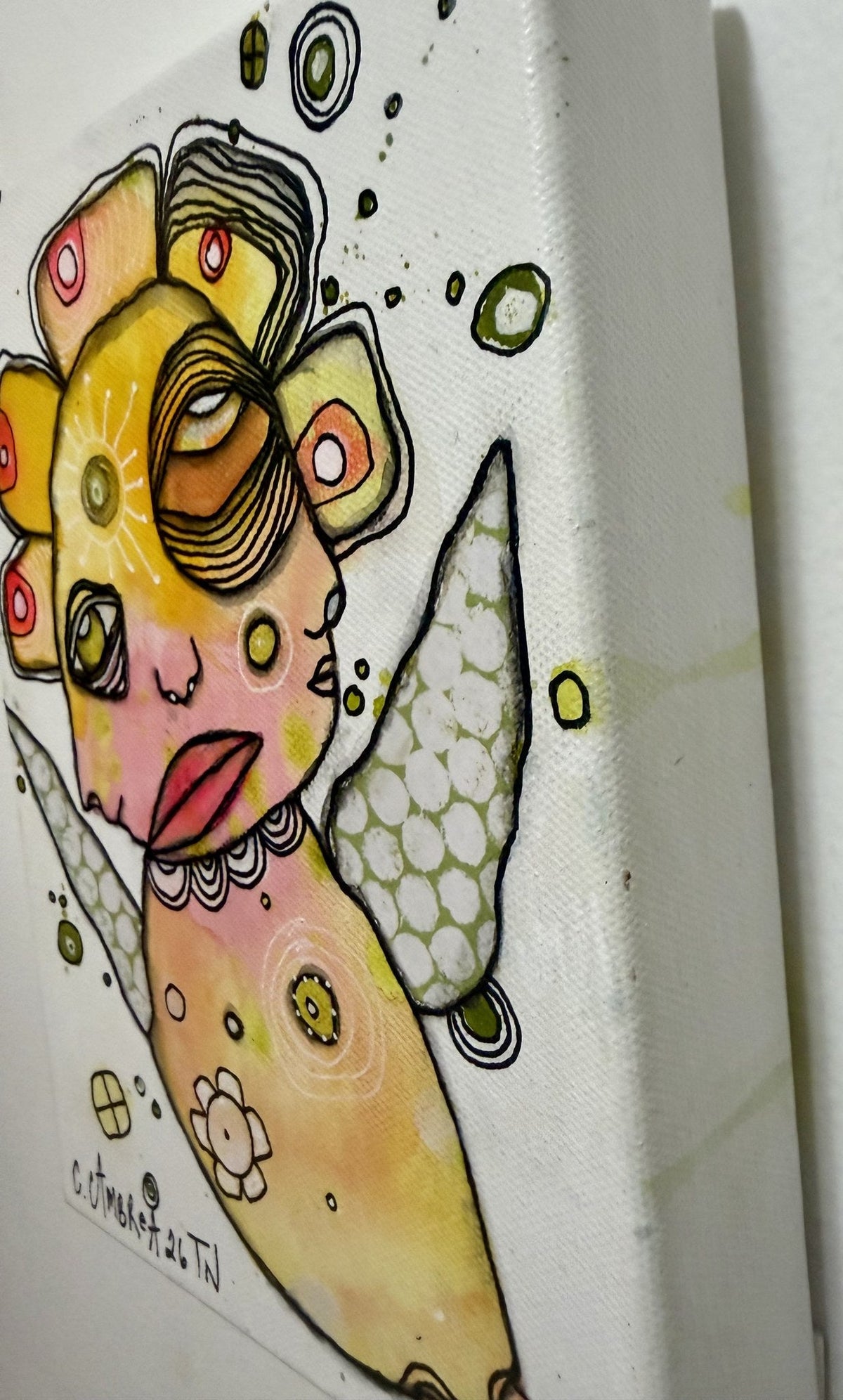 Side angle detail showing canvas edge depth and dotted wing texture on this mixed media artwork