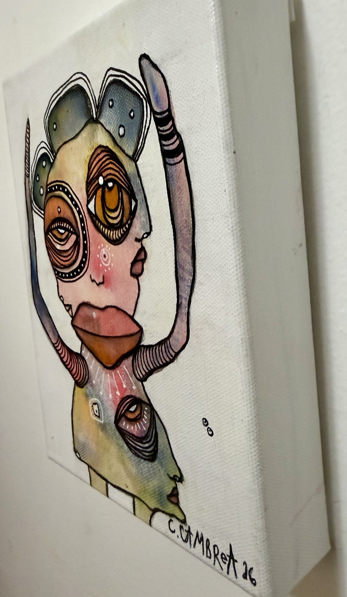 Angled side view of the canvas showing its depth and the hand-painted signature C. Cambrea 26