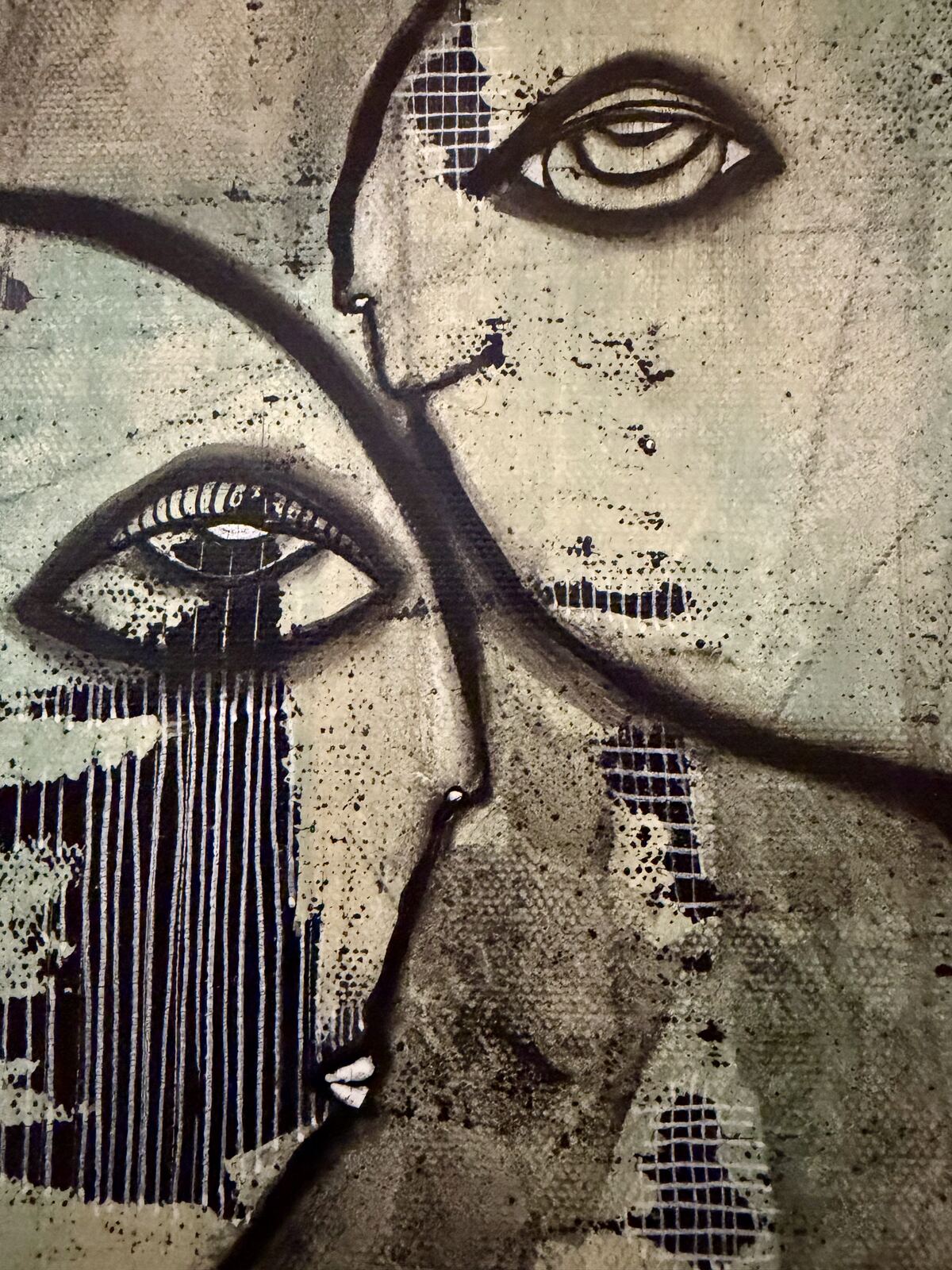 Close-up detail of the two faces and eyes in "We Meet Again"