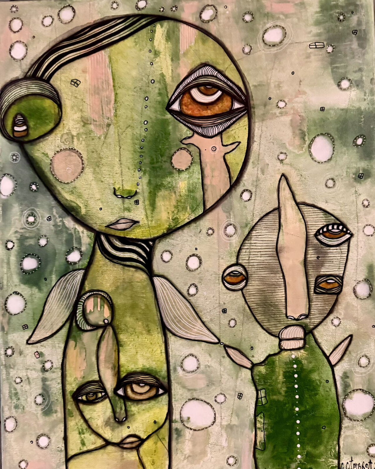 Full front view of "Connected" mixed media painting showing two green-toned faces with large eyes joined together, surrounded by circular bubble motifs