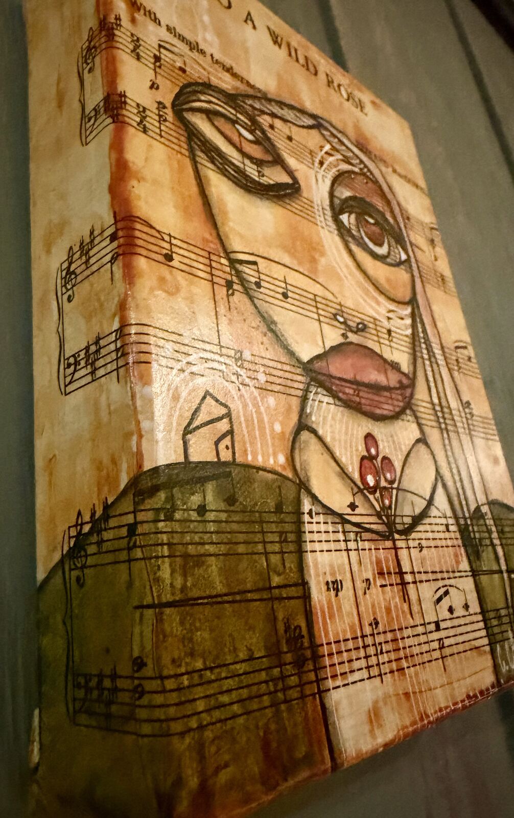 Angled side view of "To A Wild Rose" canvas showing painted edge and sheet music wrap
