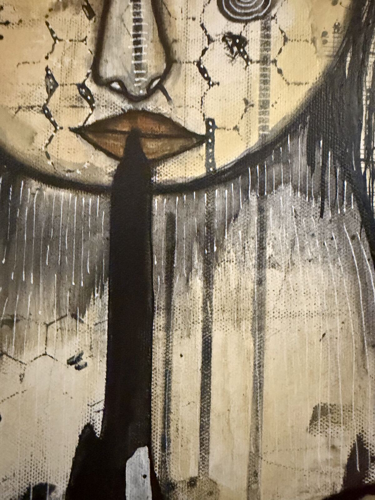 Close-up detail of the lower face and drip painting in "Welcome"