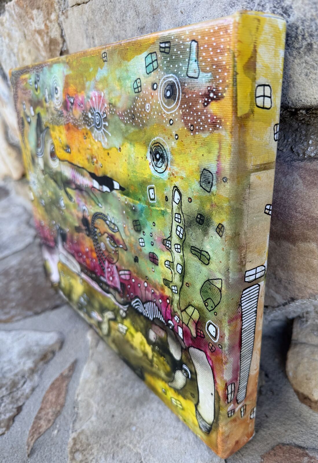 Angled close-up of "The In Between" showing the canvas depth and texture